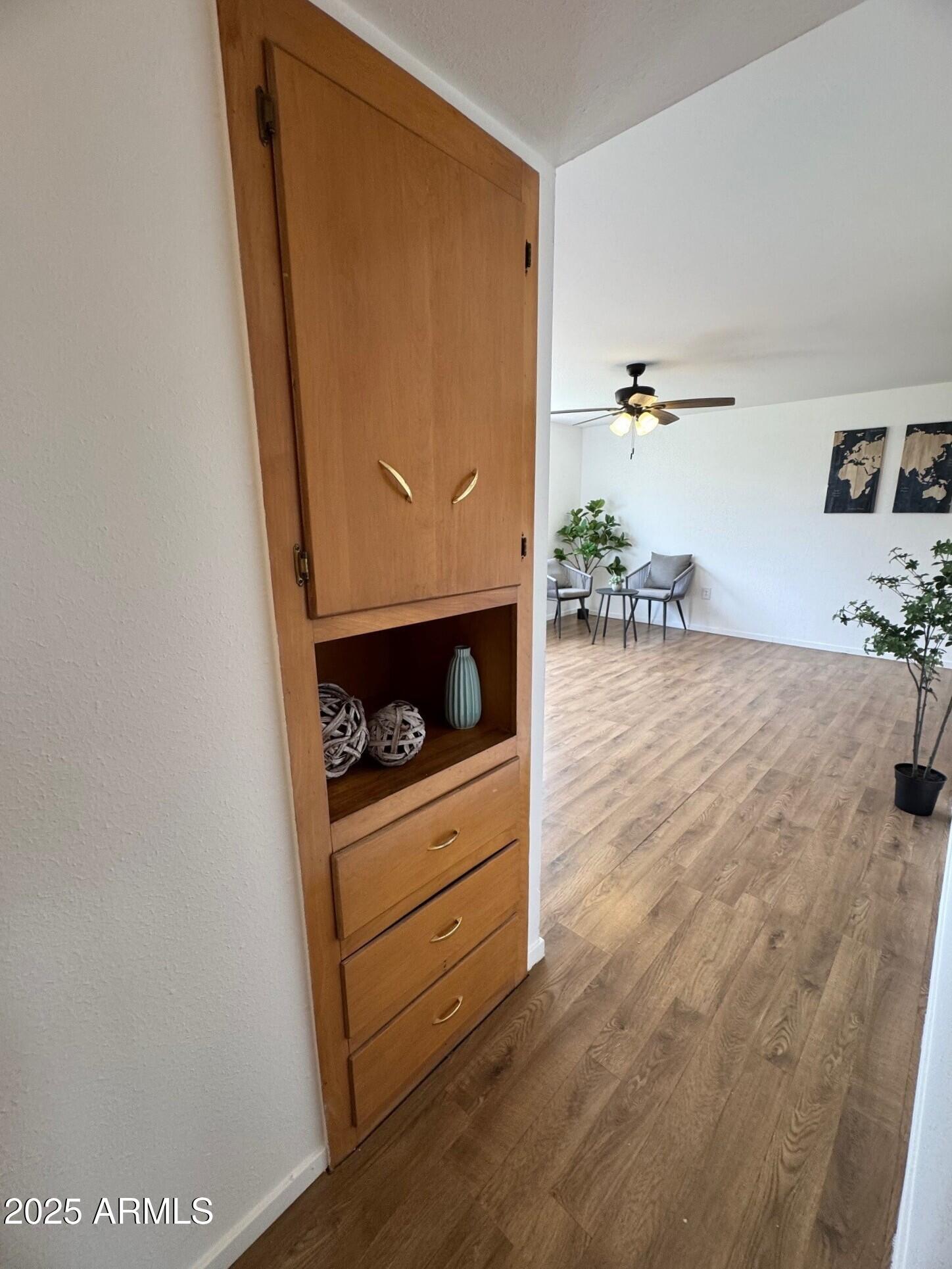 504 Alegre Place Bisbee, AZ 85603 - Photo 21 of 28 a room with furniture and wooden floor