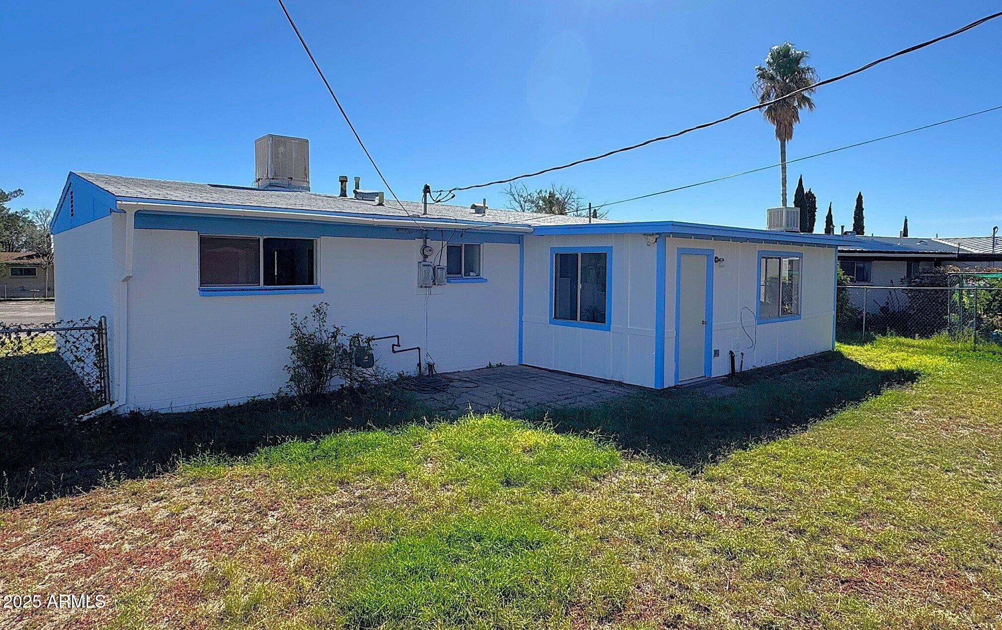 504 Alegre Place Bisbee, AZ 85603 - Photo 4 of 28 a front view of a house with garden