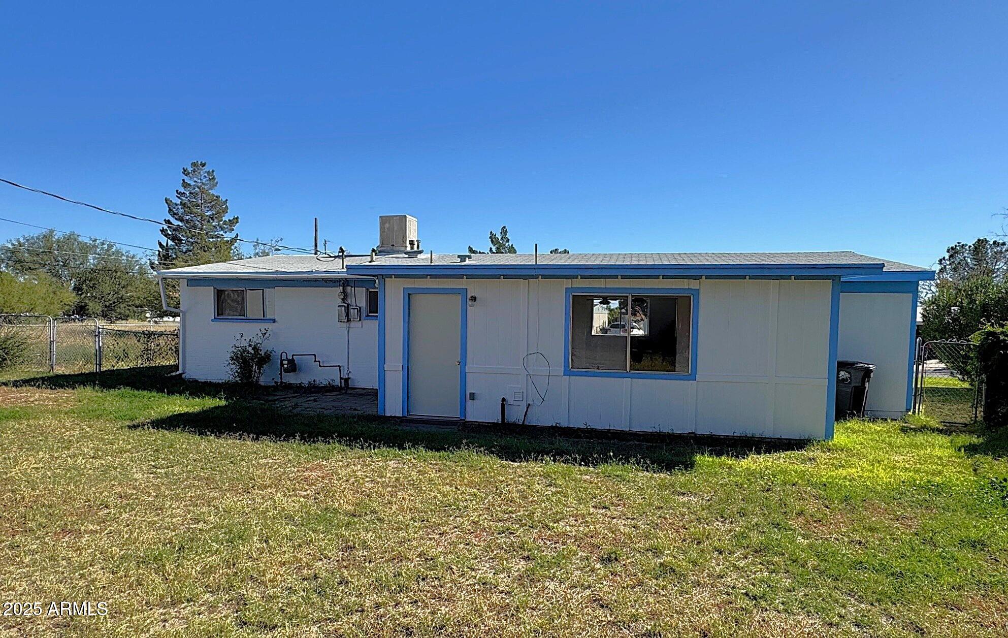 504 Alegre Place Bisbee, AZ 85603 - Photo 5 of 28 a view of a house with a garden