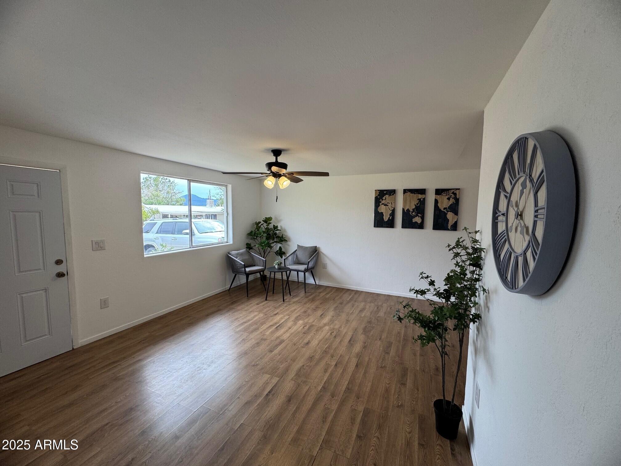 504 Alegre Place Bisbee, AZ 85603 - Photo 6 of 28 a living room with furniture and a wooden floor