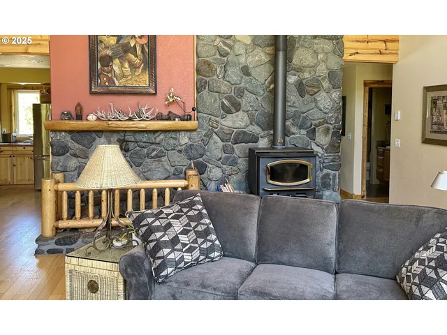 a living room with a couch and a fireplace