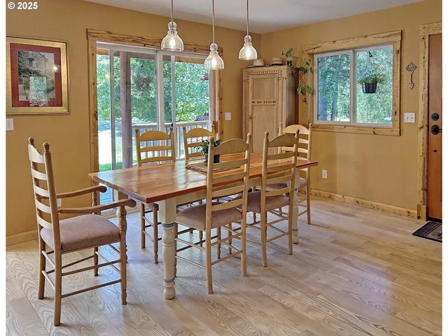 a dining room with furniture window wooden floor