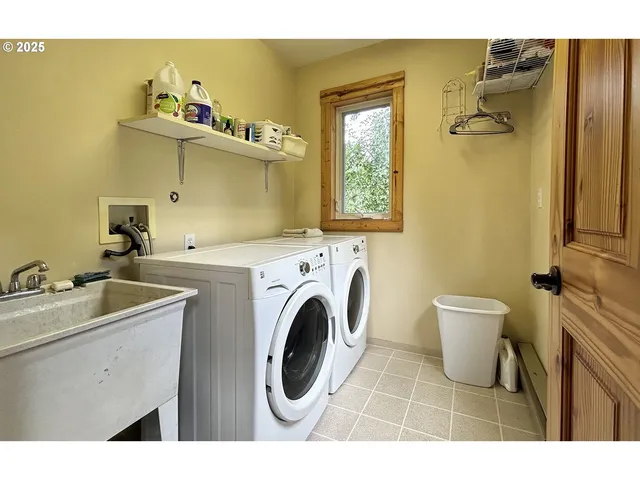 a bathroom with a sink mirror vanity and toilet