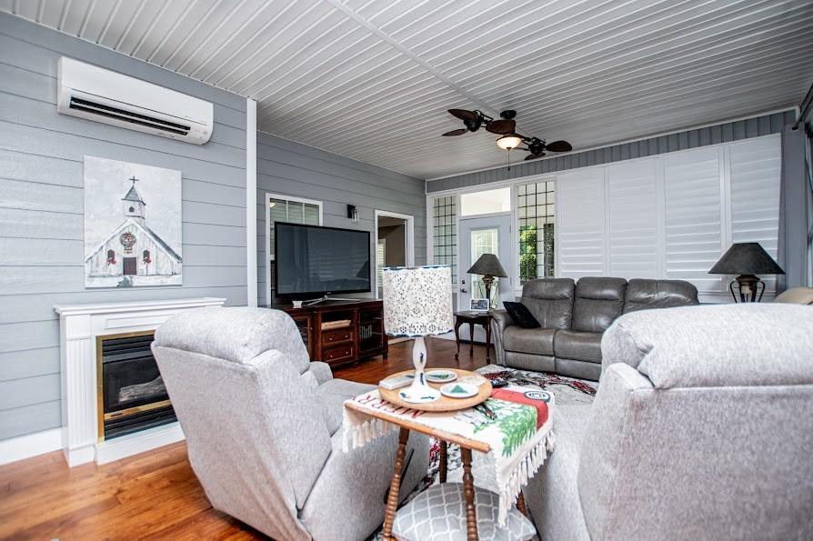 575 Liberty Church Road Carrollton, GA 30116 - Photo 29 of 95 a living room with fireplace furniture and a flat screen tv