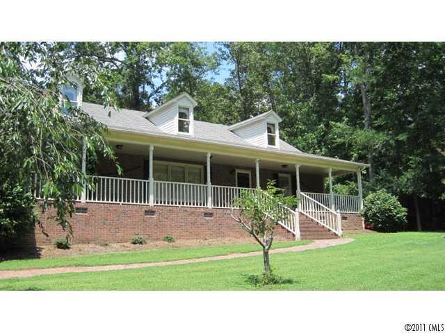 633 Marvin Road Indian Land, SC 29707 - Photo 1 of 16 a balcony with a bench in front of a house