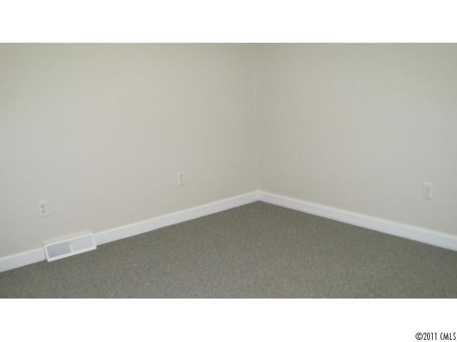 633 Marvin Road Indian Land, SC 29707 - Photo 13 of 16 a open hall with a bench