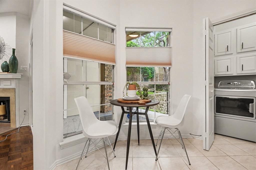 14277 Preston Road, Unit 315 Dallas, TX 75254 - Photo 14 of 20 Sunny breakfast nook by the windows, perfect for enjoying morning light.