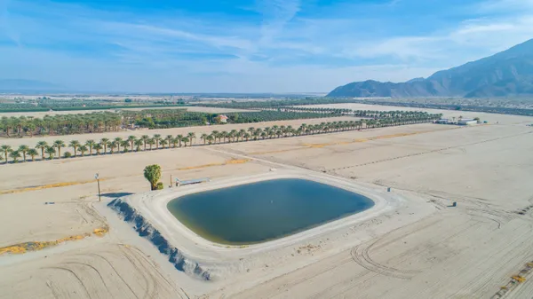 a view of a swimming pool with a yard