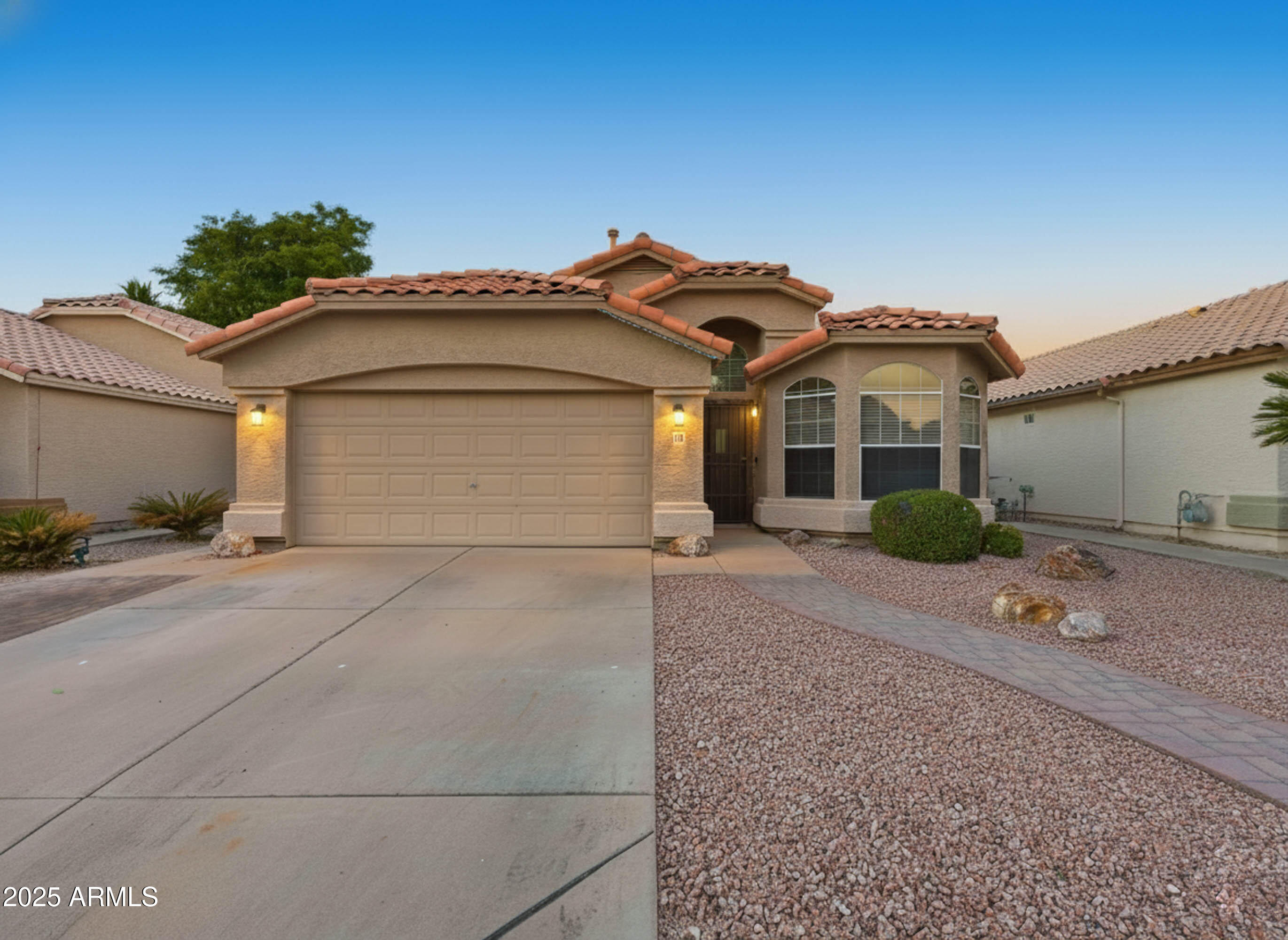 1516 East Cheyenne Street Gilbert, AZ 85296 - Photo 1 of 73 a front view of a house with a yard and garage