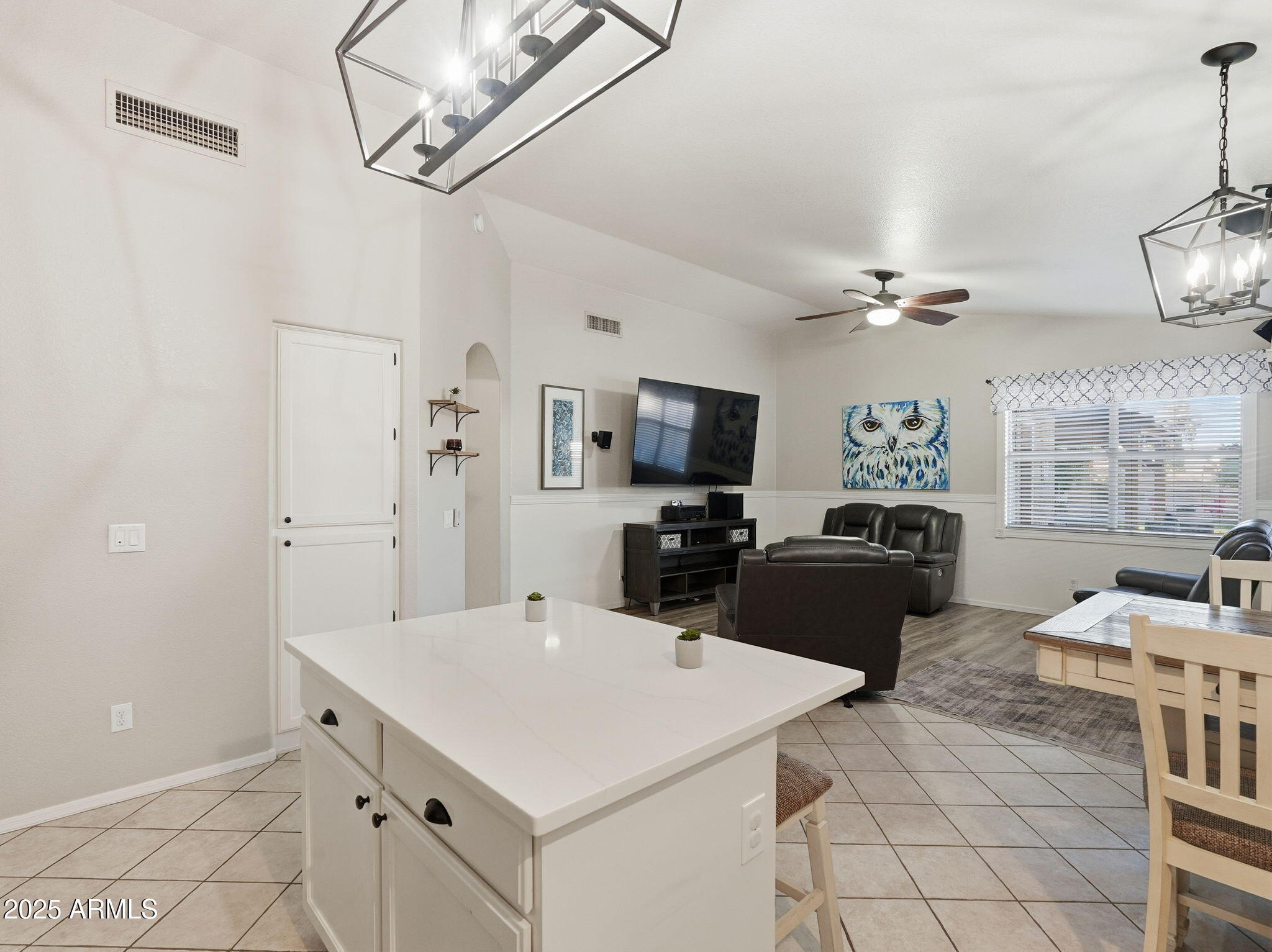 1516 East Cheyenne Street Gilbert, AZ 85296 - Photo 16 of 73 a kitchen with stainless steel appliances kitchen island granite countertop a sink and a refrigerator