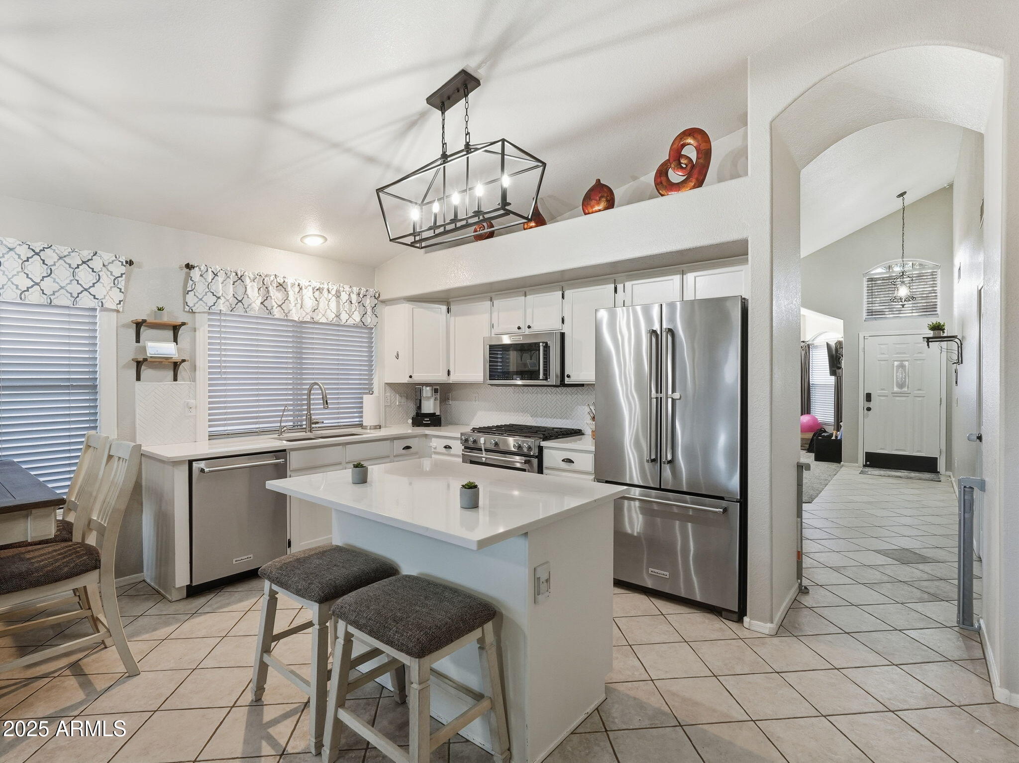 1516 East Cheyenne Street Gilbert, AZ 85296 - Photo 17 of 73 a kitchen with refrigerator cabinets and a sink