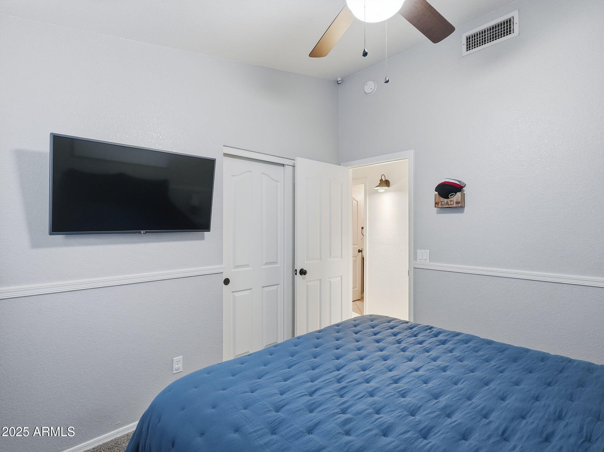 1516 East Cheyenne Street Gilbert, AZ 85296 - Photo 27 of 73 a bedroom with a bed and a flat screen tv