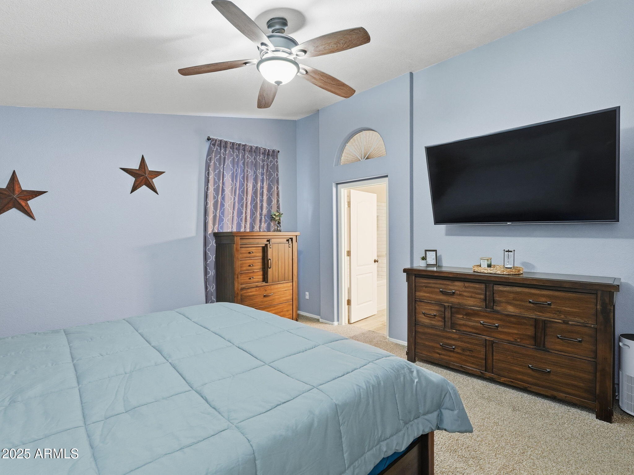 1516 East Cheyenne Street Gilbert, AZ 85296 - Photo 29 of 73 a bedroom with a bed and a flat screen tv