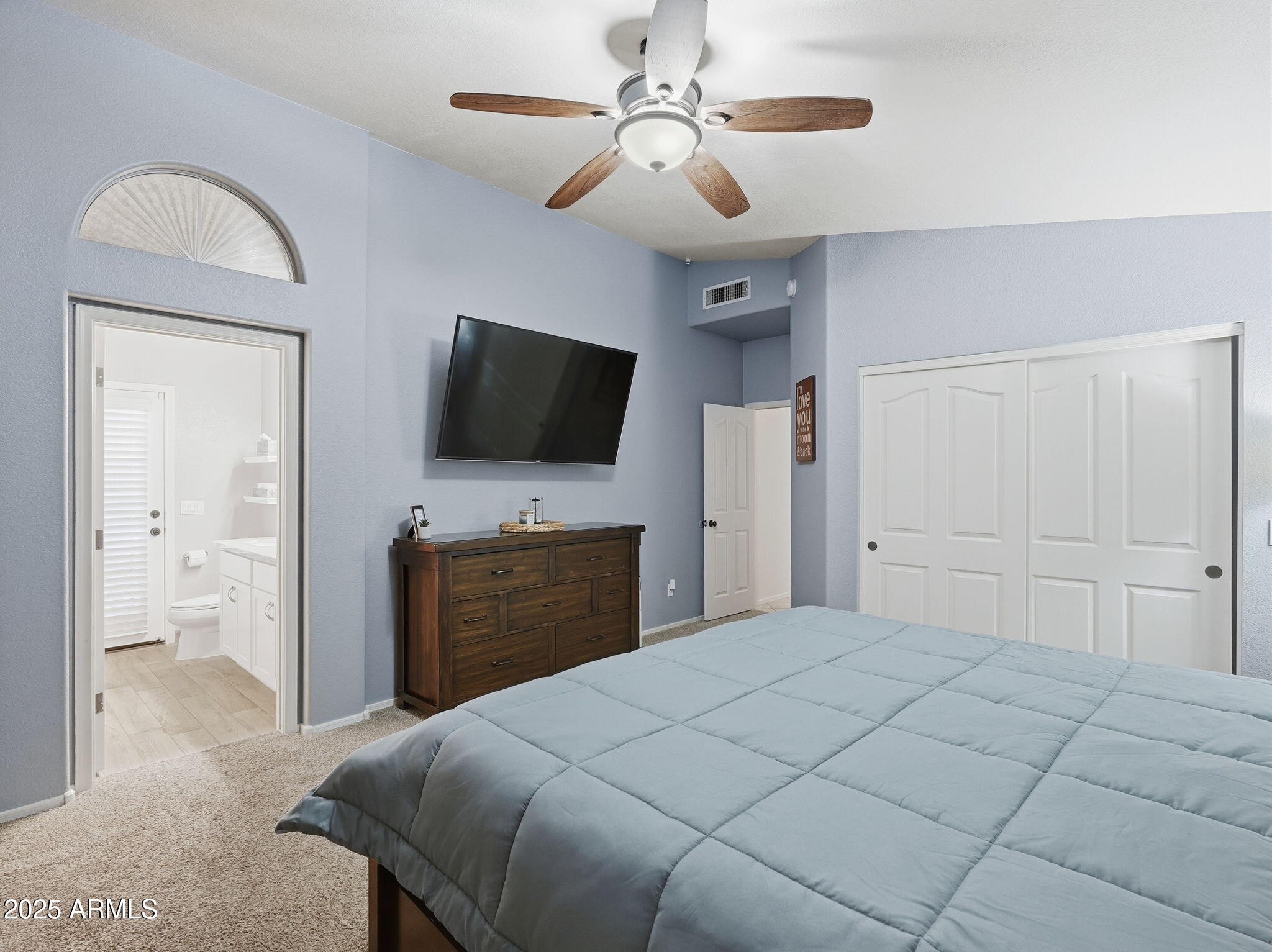 1516 East Cheyenne Street Gilbert, AZ 85296 - Photo 31 of 73 a bedroom with a bed and a flat screen tv