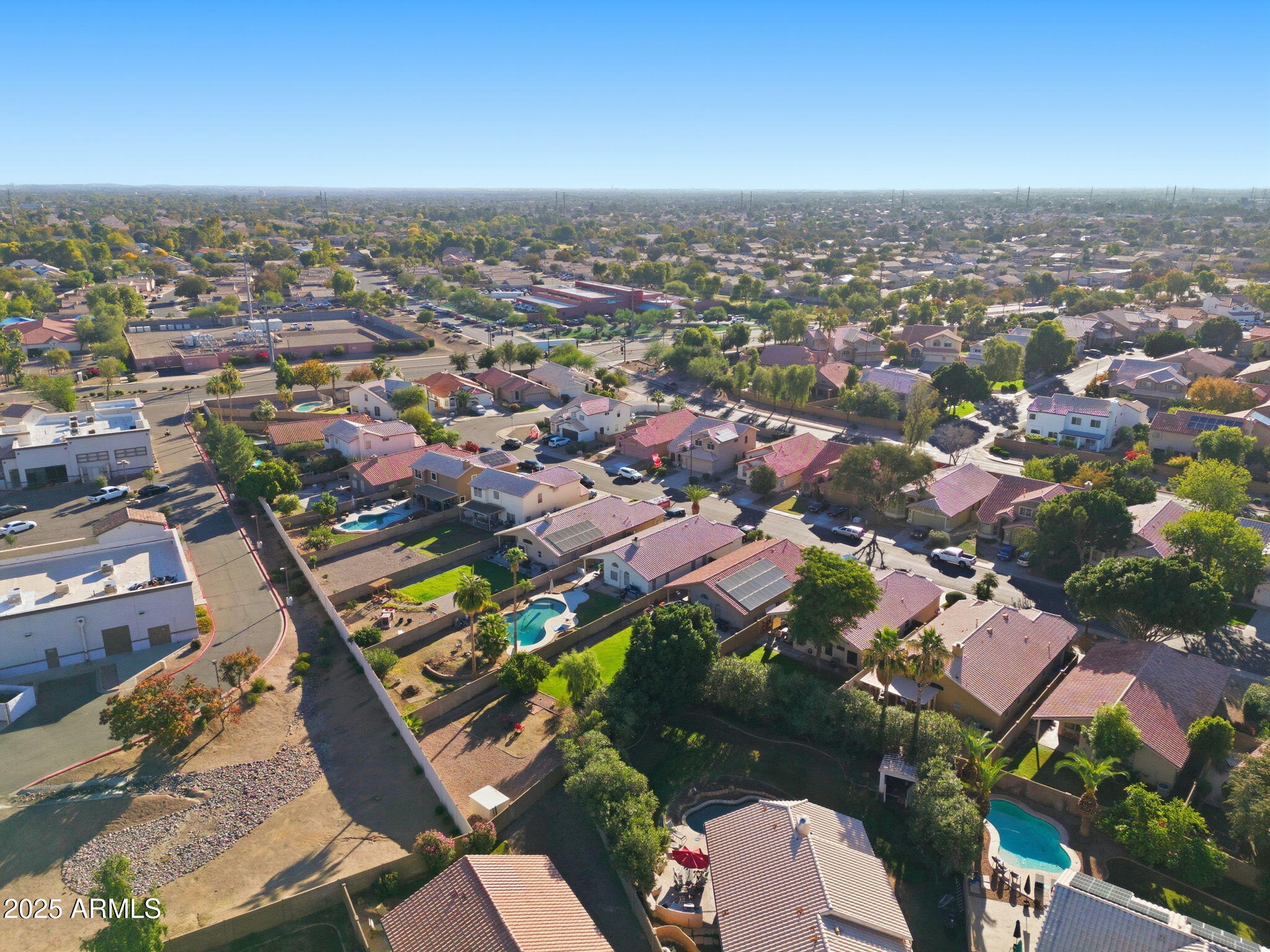 1516 East Cheyenne Street Gilbert, AZ 85296 - Photo 58 of 73 an aerial view of a city with lots of residential buildings
