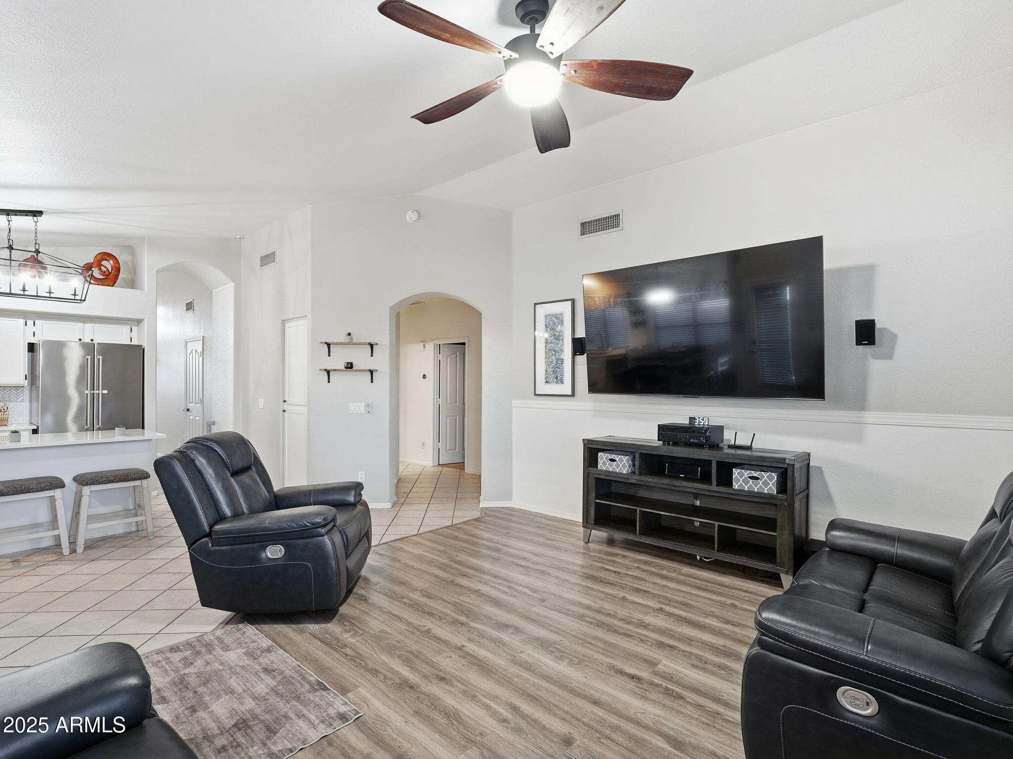 1516 East Cheyenne Street Gilbert, AZ 85296 - Photo 10 of 73 a living room with furniture and a flat screen tv
