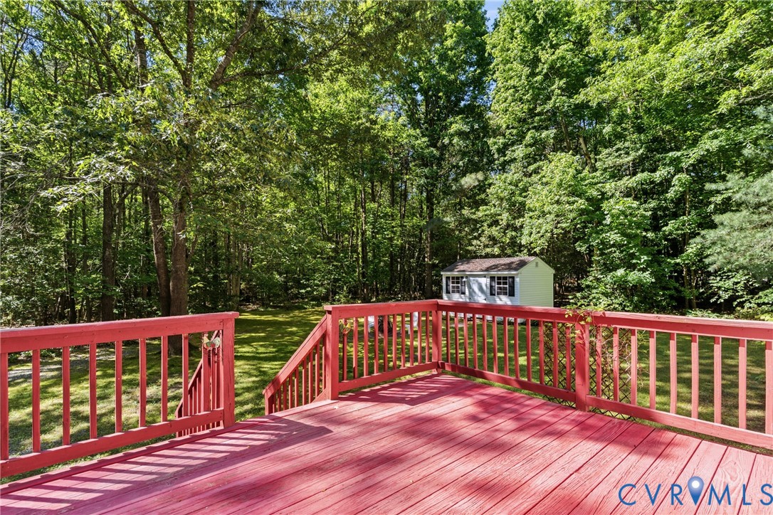 12654 Mt Olive Cohoke Road West Point, VA 23181 - Photo 25 of 31 a view of balcony with wooden deck and outdoor seating