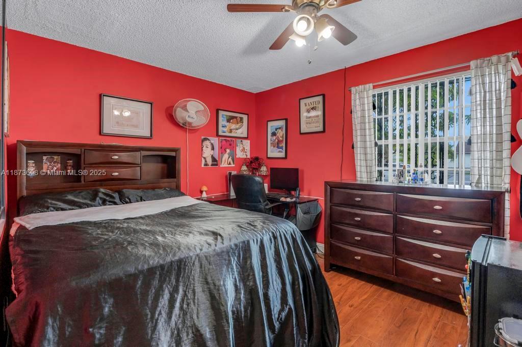26023 Southwest 133rd Place Homestead, FL 33032 - Photo 21 of 39 a bed room with a bed and a dresser