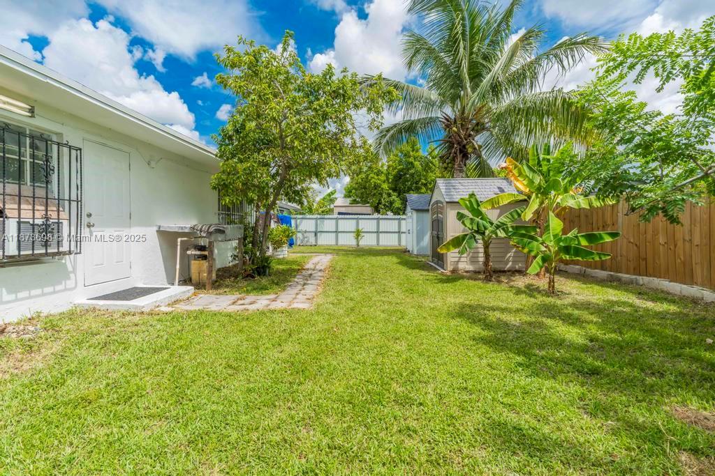 26023 Southwest 133rd Place Homestead, FL 33032 - Photo 30 of 39 a view of a backyard with a slide