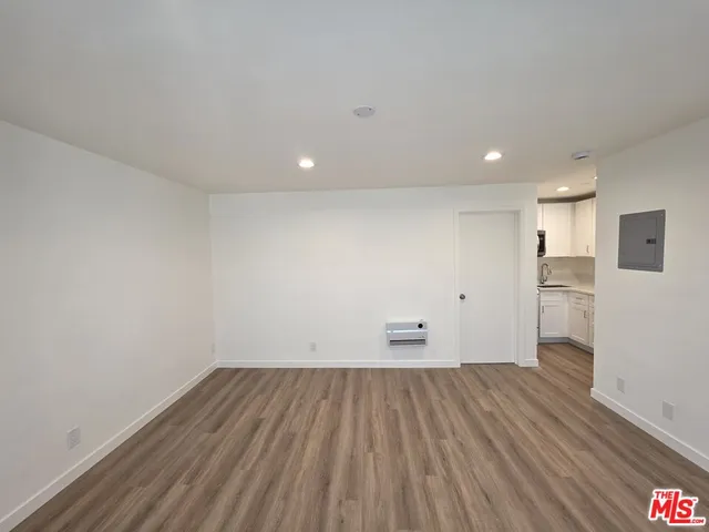 a view of kitchen with wooden floor