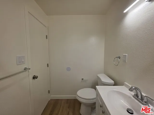 a bathroom with a sink and toilet