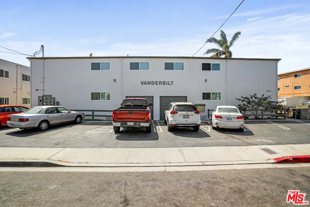 a view of a car parked in front of a building