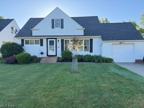 1559 Chelmsford Road Cleveland, OH 44124 - Photo 1 of 29 View of front facade with a garage and a front lawn