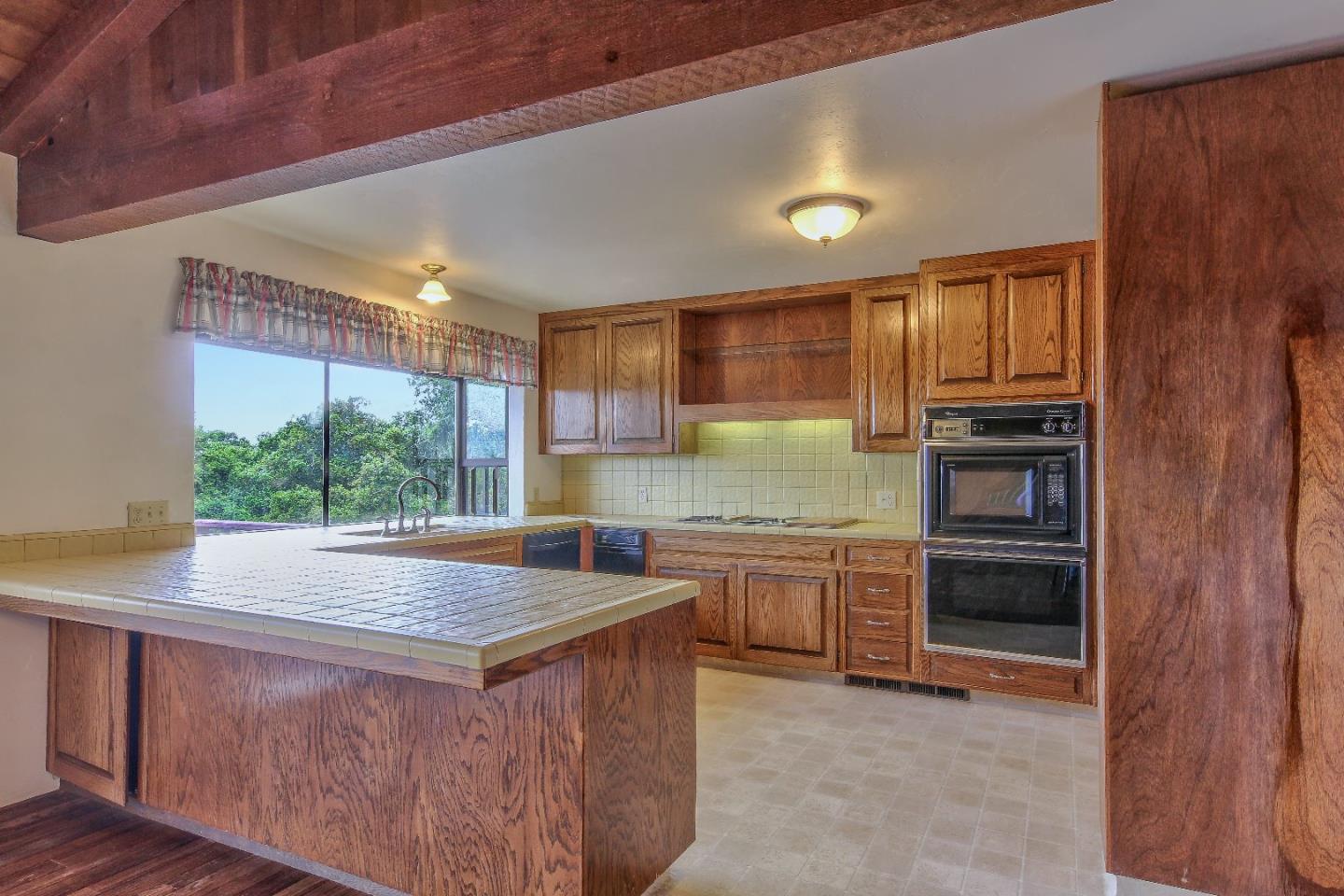 96 Robley Road Salinas, CA 93908 - Photo 12 of 41 a kitchen with a stove a sink and a refrigerator