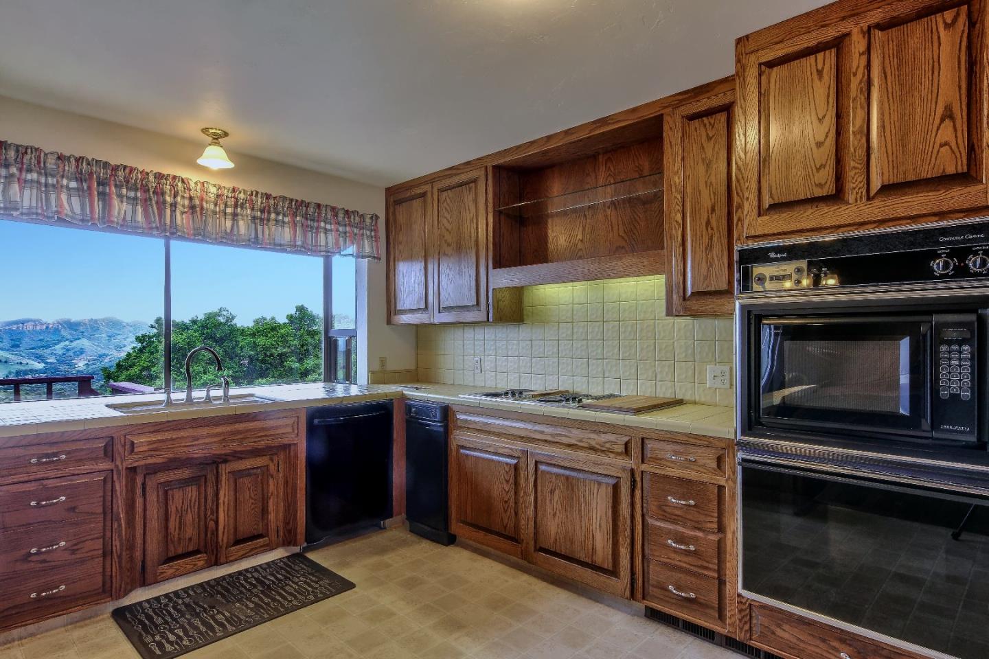 96 Robley Road Salinas, CA 93908 - Photo 13 of 41 a kitchen with a sink stove and microwave