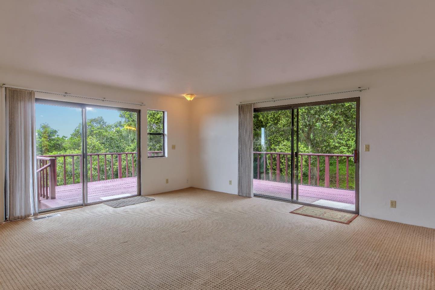 96 Robley Road Salinas, CA 93908 - Photo 18 of 41 a view of an empty room with wooden floor and door
