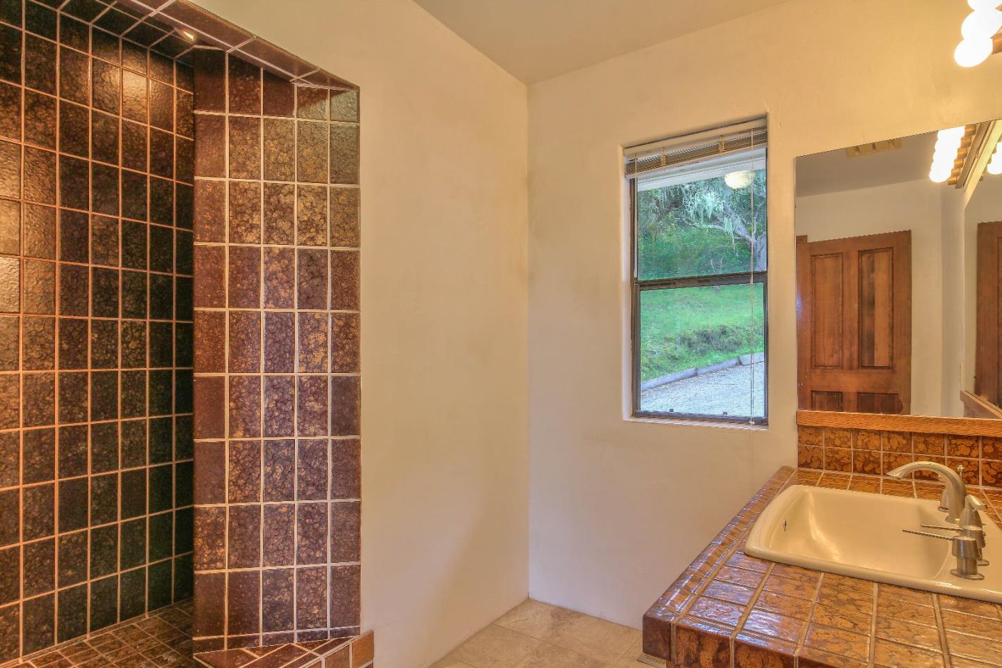 96 Robley Road Salinas, CA 93908 - Photo 25 of 41 a bathroom with a tub a sink a window and shower