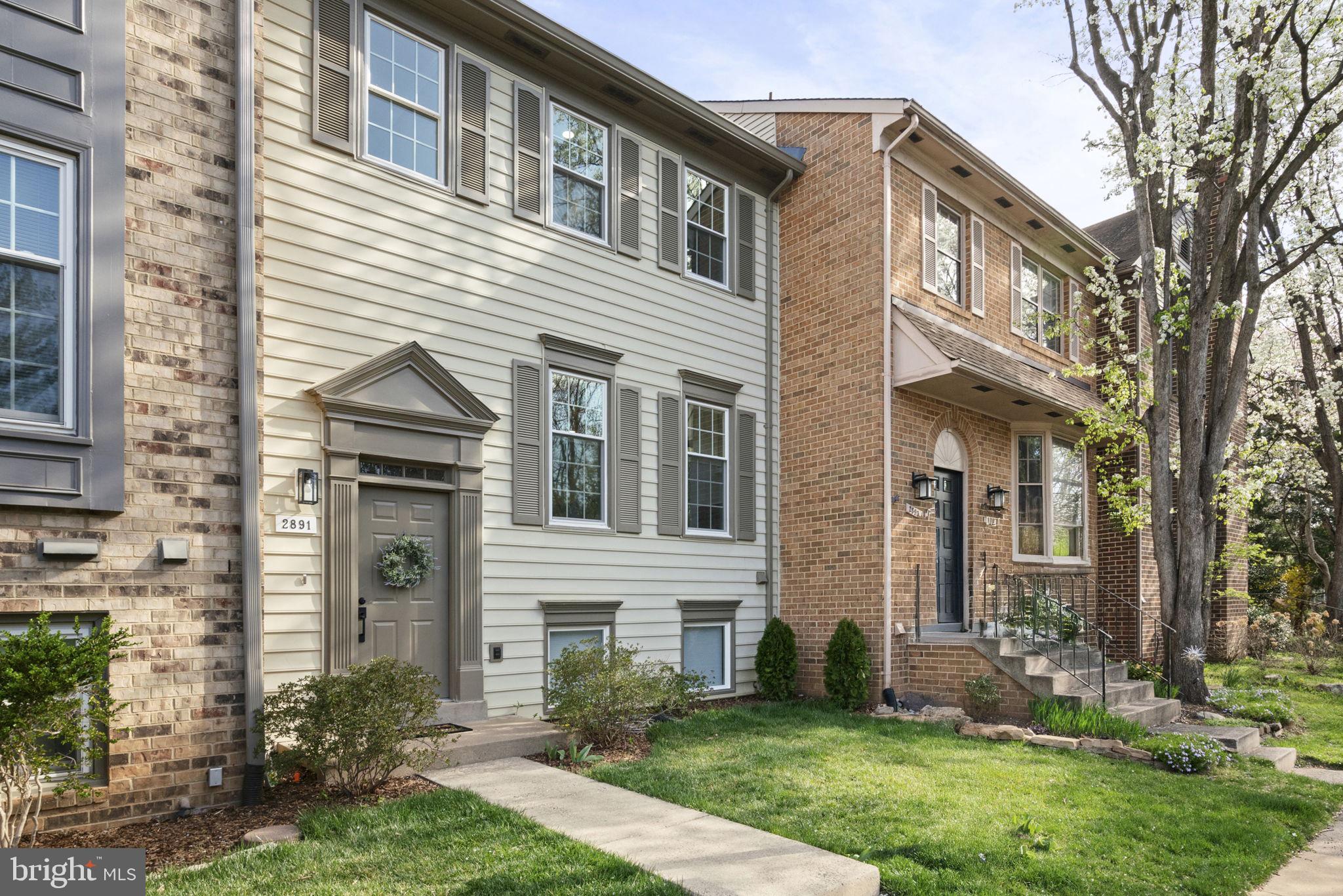 2891 Kelly Square Vienna, VA 22181 - Photo 1 of 39 a view of a white house next to a yard