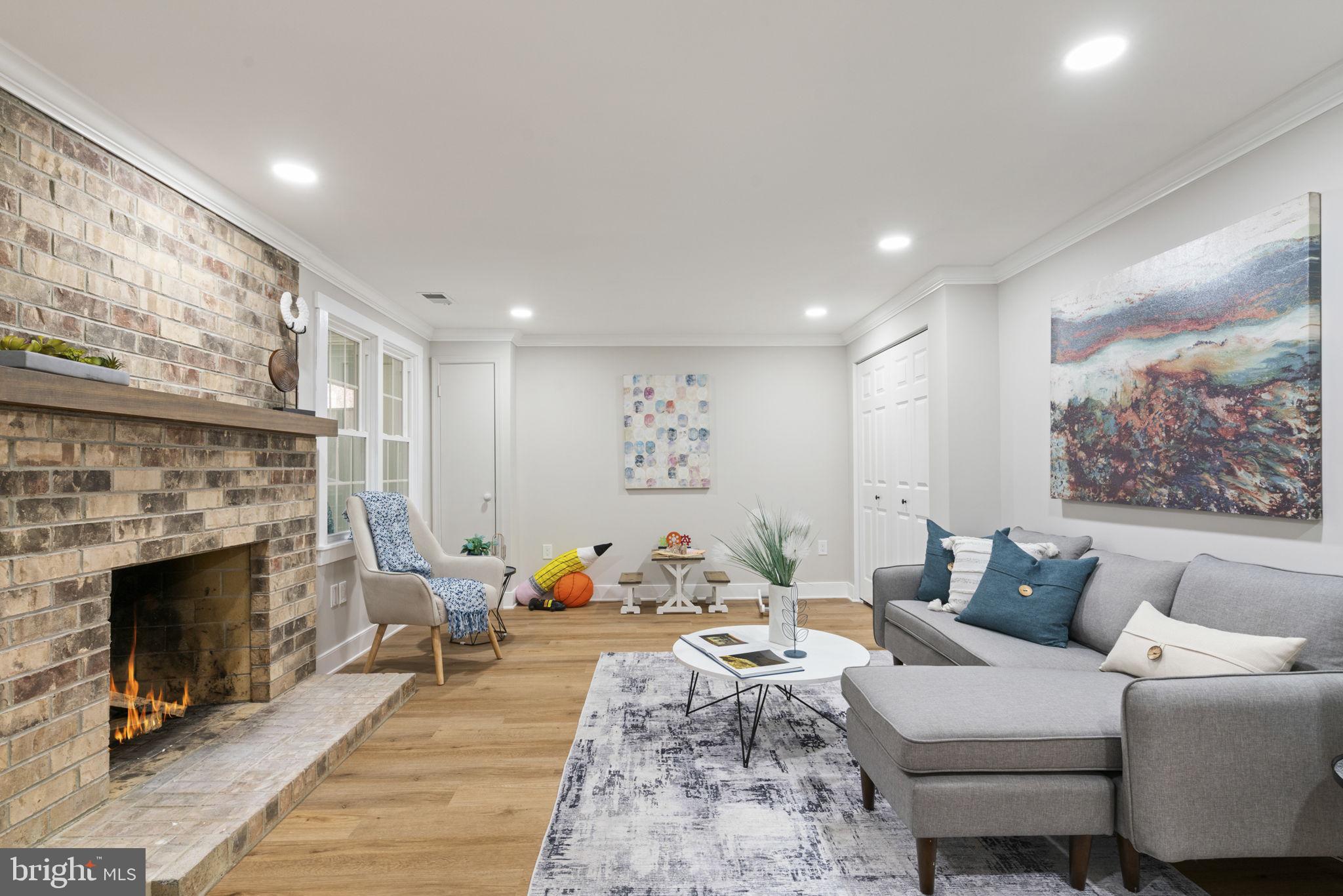 2891 Kelly Square Vienna, VA 22181 - Photo 14 of 39 a living room with furniture and a fireplace