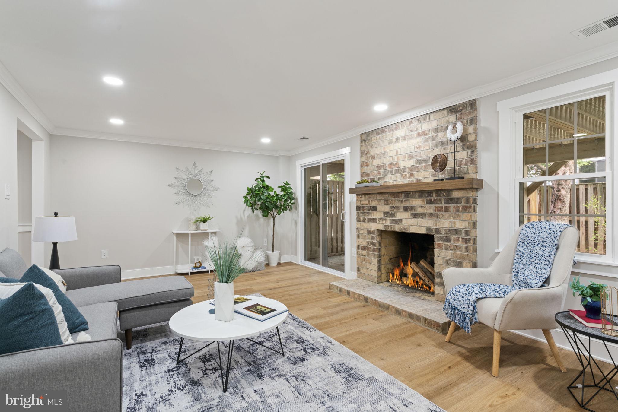 2891 Kelly Square Vienna, VA 22181 - Photo 15 of 39 a living room with furniture and a fireplace