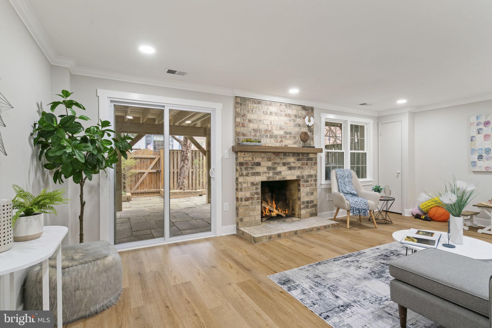 2891 Kelly Square Vienna, VA 22181 - Photo 16 of 39 a living room with furniture and a fireplace
