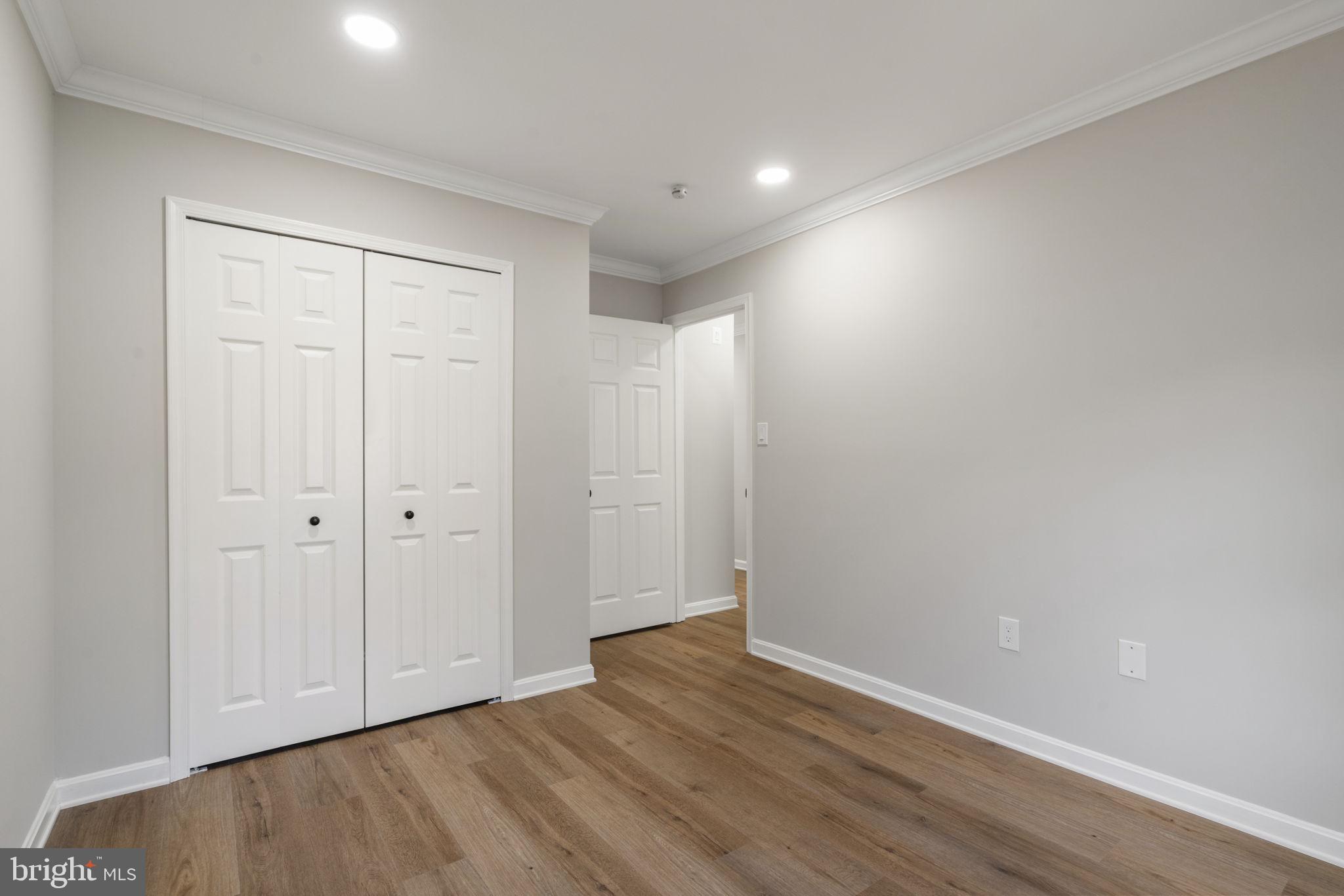 2891 Kelly Square Vienna, VA 22181 - Photo 25 of 39 a view of an empty room with wooden floor