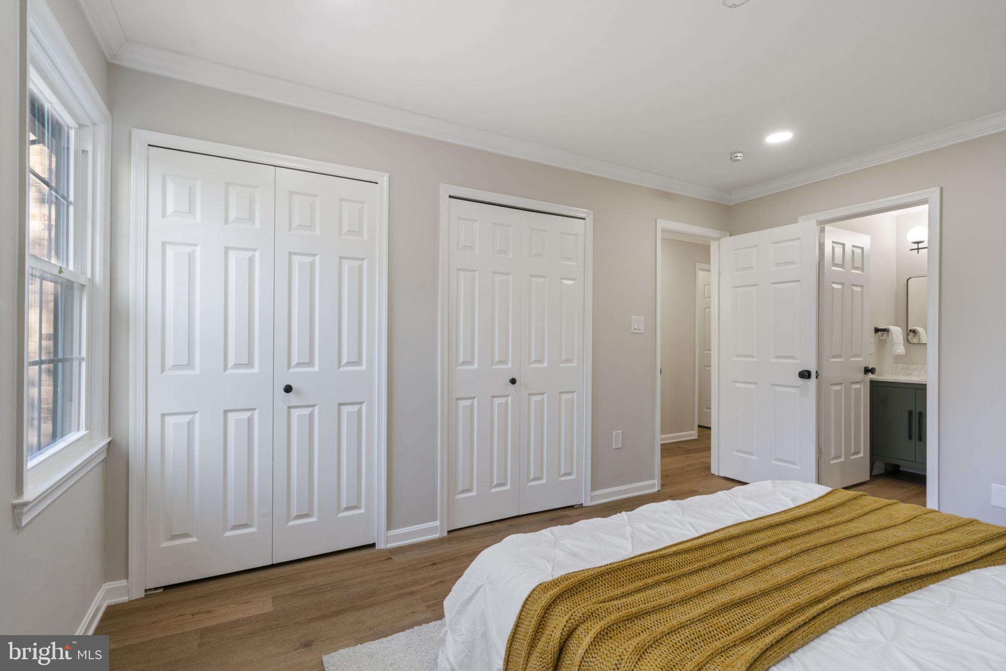 2891 Kelly Square Vienna, VA 22181 - Photo 27 of 39 a bedroom with a bed and wooden floor