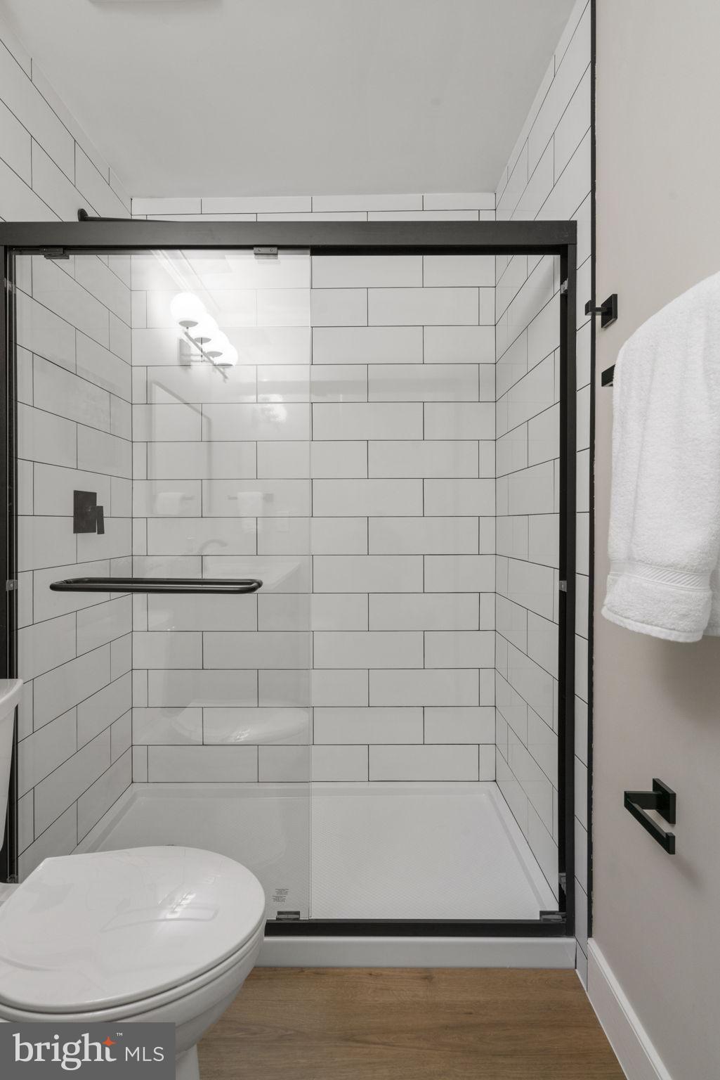 2891 Kelly Square Vienna, VA 22181 - Photo 29 of 39 a bathroom with a toilet and a shower