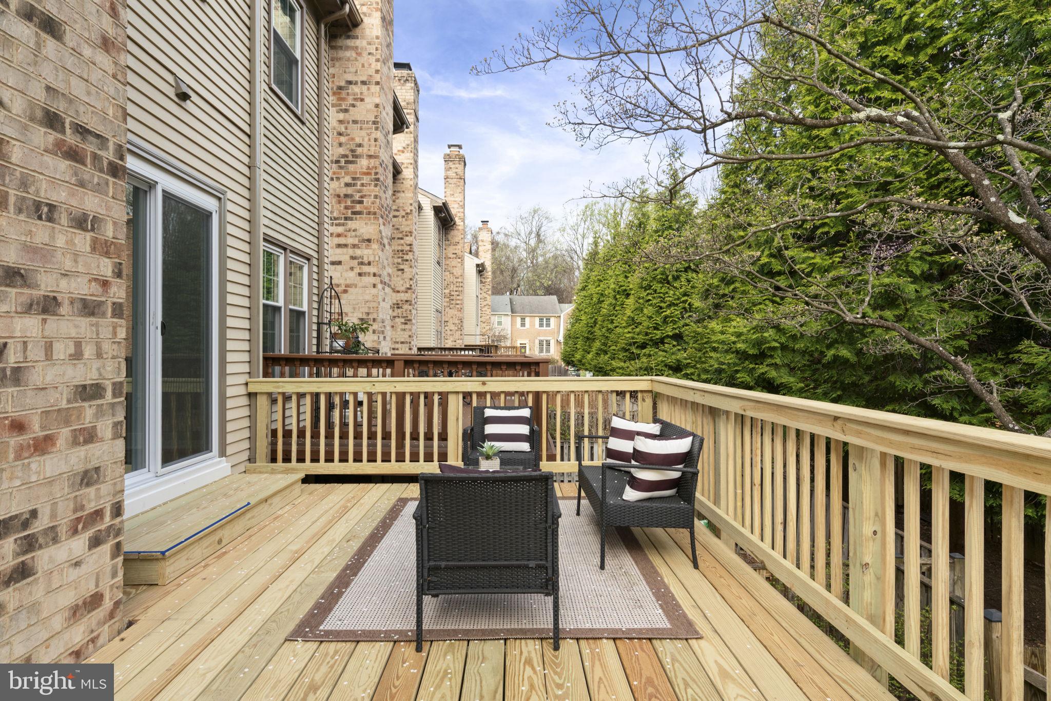2891 Kelly Square Vienna, VA 22181 - Photo 33 of 39 a view of balcony with wooden floor and fence