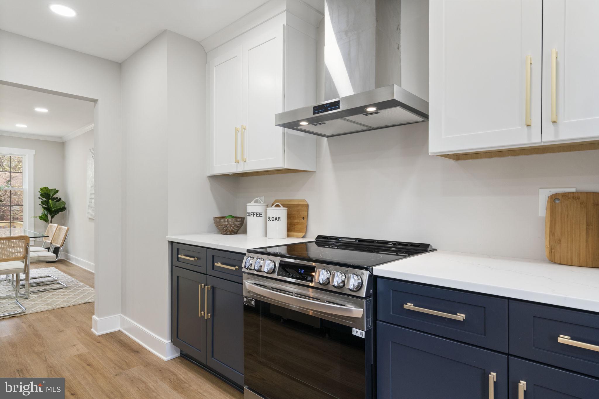 2891 Kelly Square Vienna, VA 22181 - Photo 7 of 39 a kitchen with stainless steel appliances granite countertop a sink stove and cabinets