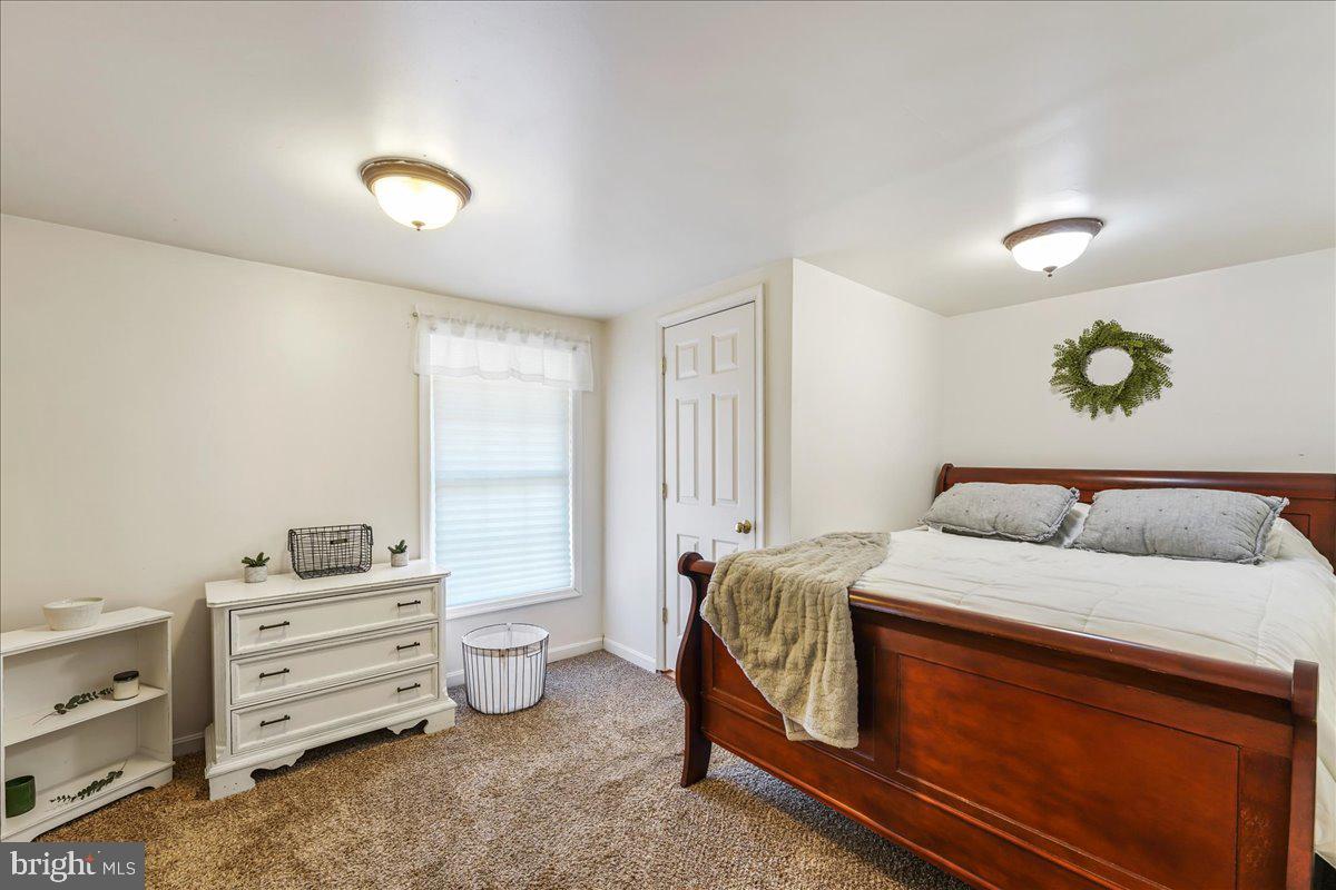 51 Carter Road Rising Sun, MD 21911 - Photo 11 of 17 a bedroom with a bed and a window