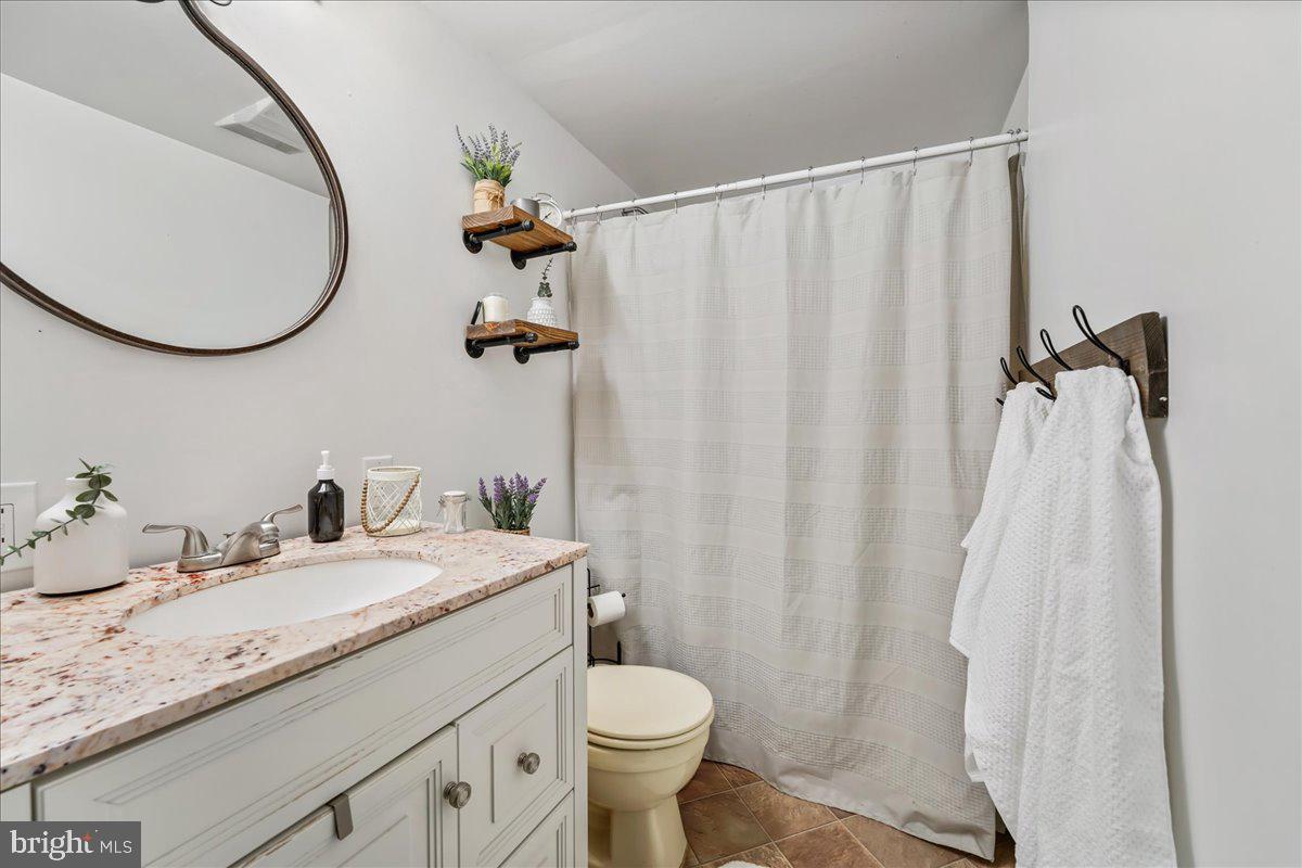 51 Carter Road Rising Sun, MD 21911 - Photo 12 of 17 a bathroom with a granite countertop sink toilet and a mirror