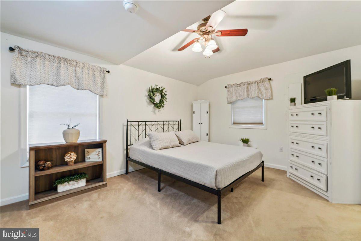 51 Carter Road Rising Sun, MD 21911 - Photo 13 of 17 a bedroom with a bed and a tv on the dresser