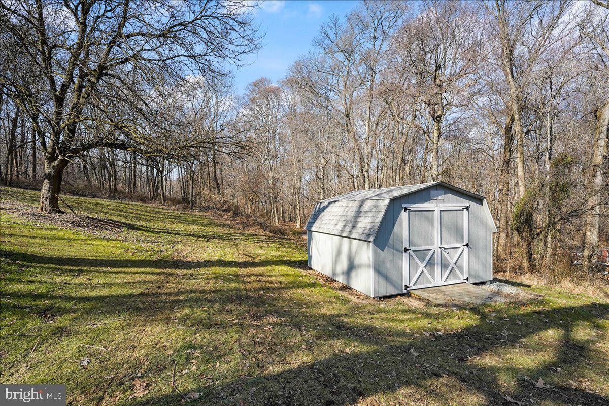 51 Carter Road Rising Sun, MD 21911 - Photo 16 of 17 a view of a tiny house with a big yard and large trees