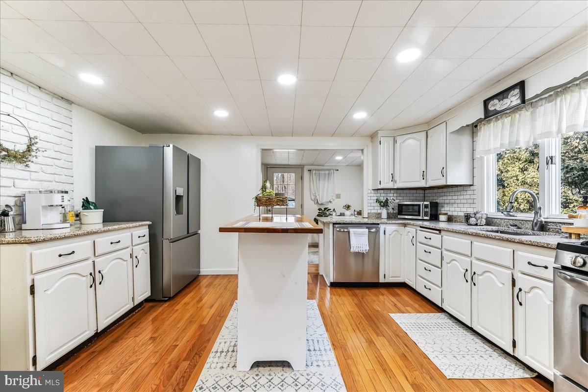 51 Carter Road Rising Sun, MD 21911 - Photo 5 of 17 a kitchen with granite countertop refrigerator sink and cabinets