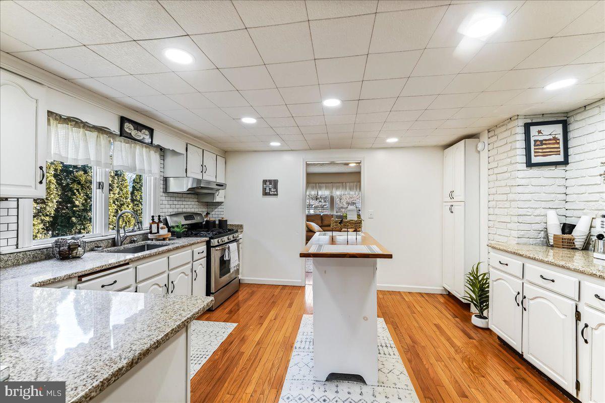 51 Carter Road Rising Sun, MD 21911 - Photo 7 of 17 a kitchen with stainless steel appliances granite countertop a sink stove and cabinets