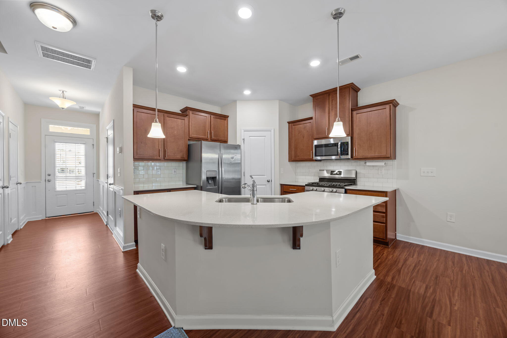 1005 Epiphany Road Morrisville, NC 27560 - Photo 4 of 23 a view of kitchen with stainless steel appliances granite countertop sink stove and wooden floor