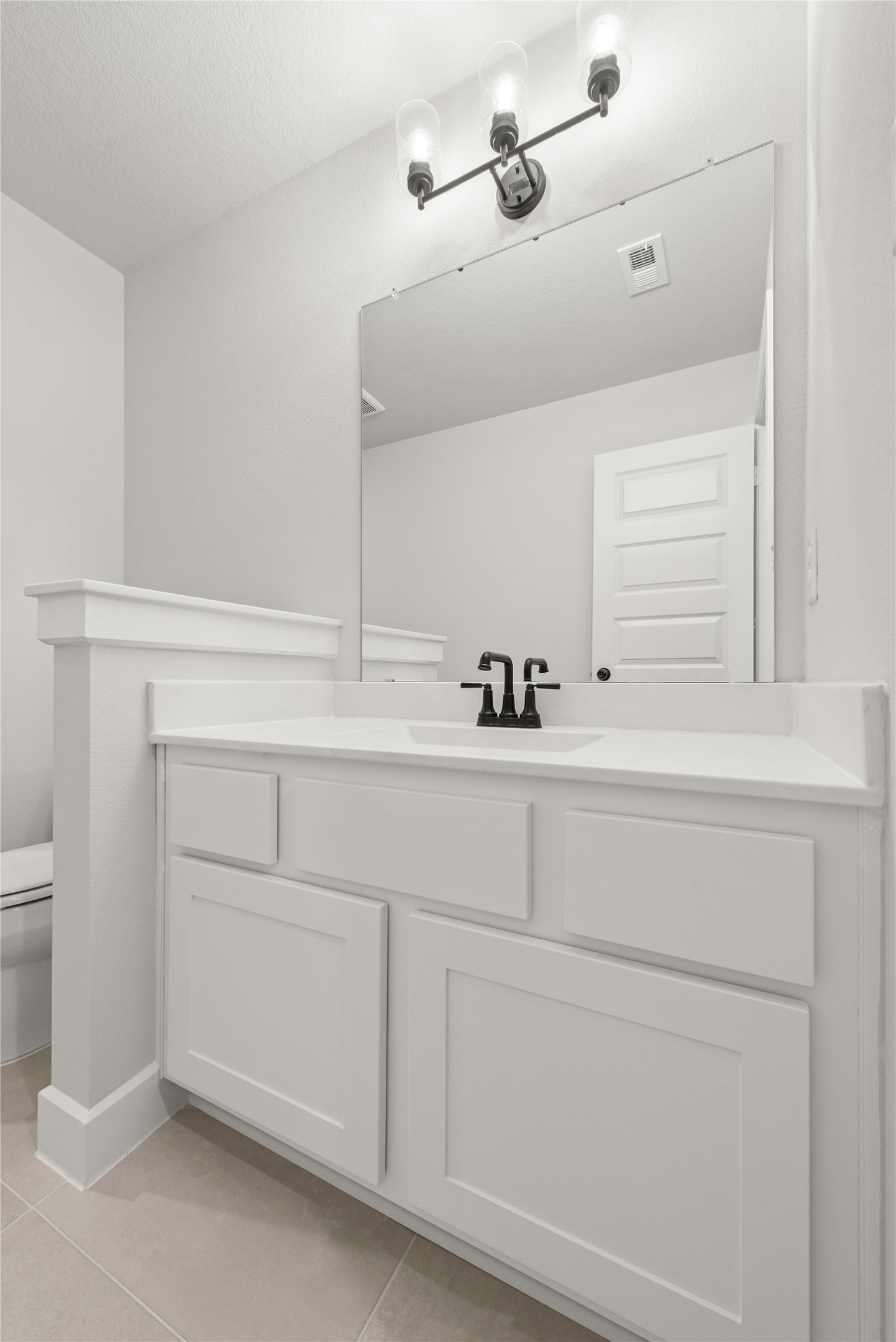 638 Walnut Br Drive Rosenberg, TX 77471 - Photo 20 of 27 a bathroom with a sink and cabinets