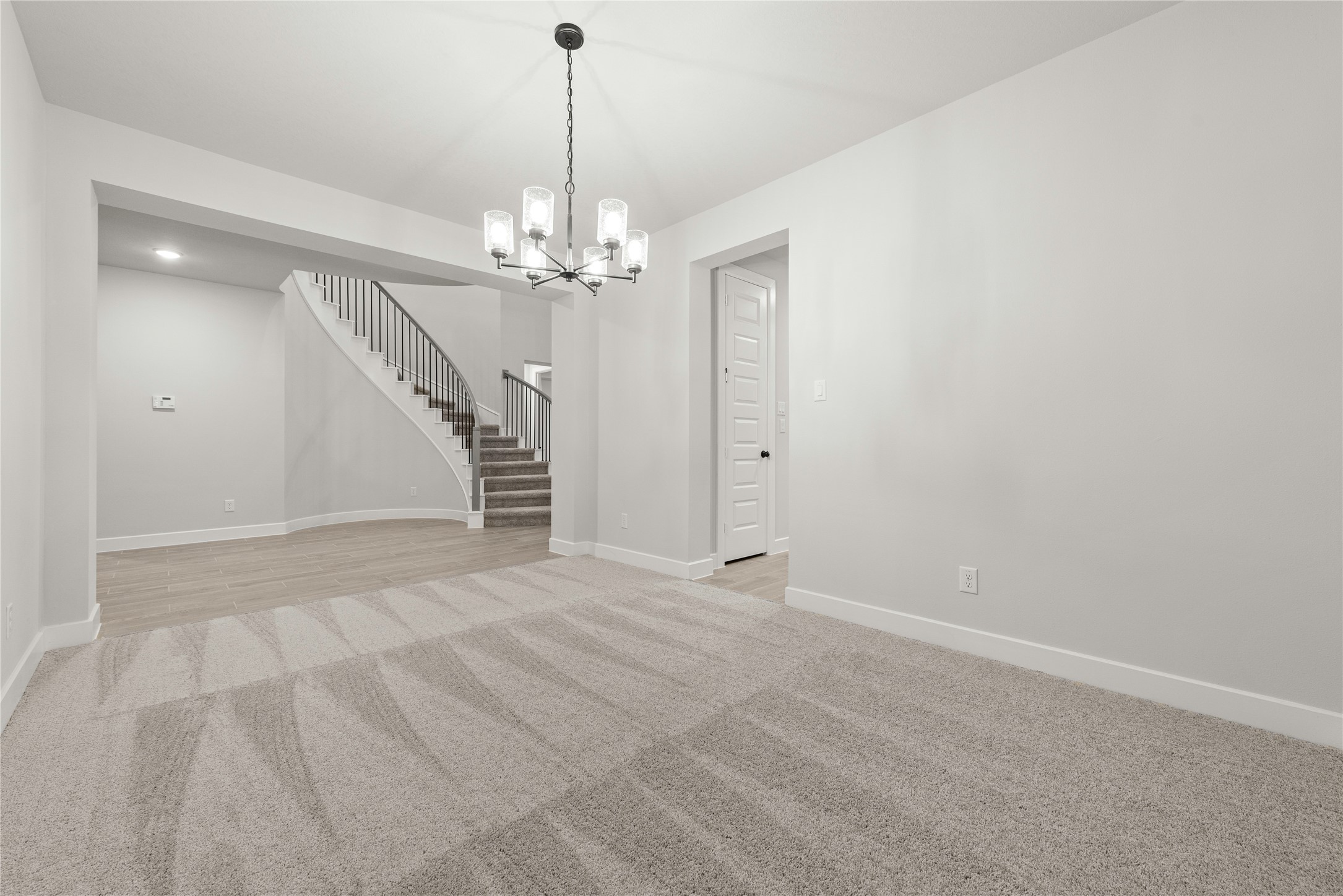 638 Walnut Br Drive Rosenberg, TX 77471 - Photo 8 of 27 a view of an empty room with a chandelier