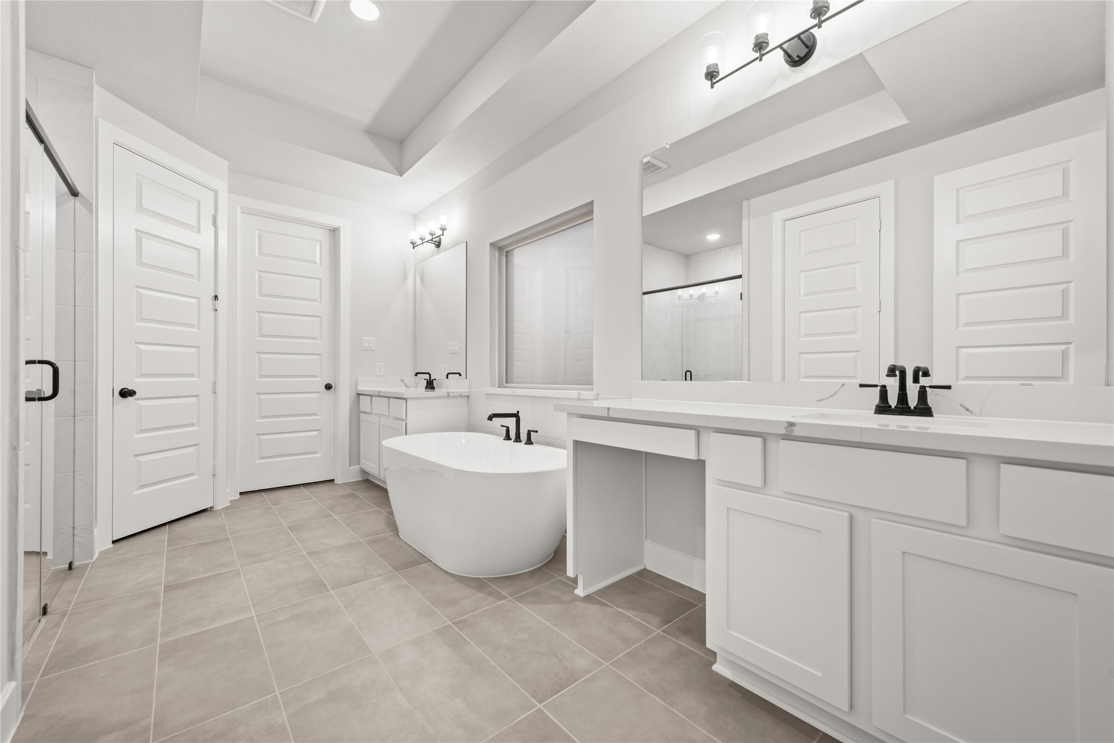 638 Walnut Br Drive Rosenberg, TX 77471 - Photo 10 of 27 a bathroom with a double vanity sink mirror and bathtub